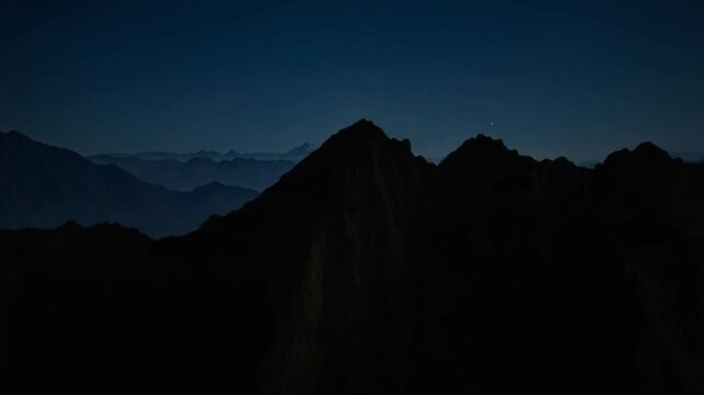 A view of a mountain range at night
