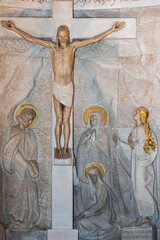 Statue of Jesus Christ crucified on the cross represented with Mary, Mary Magdalene and Saint John.