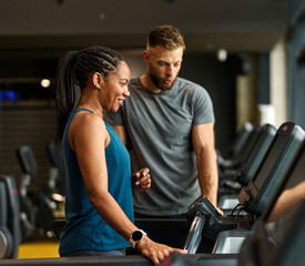 Obraz premium gym sport fitness exercise health woman treadmill training coach trainer instructor personal running equipment healthy indoor fit machine active workout