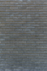 Old gray brick wall. Dark atmosphere of dramatic background.