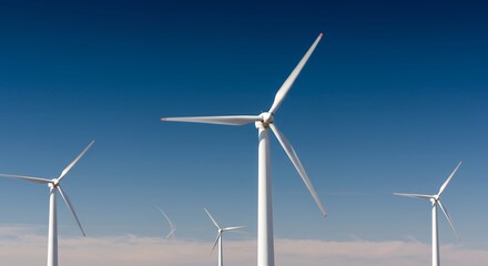 Wind Turbines Generating Clean Energy Against a Clear Blue Sky on a Sunny Day