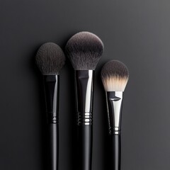Elegant layout of artistic makeup brushes in gray tones arranged with negative space for creative text placement