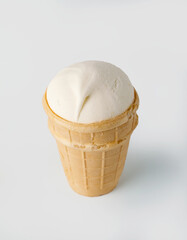 vanilla ice cream in a waffle cone, isolated on white background, top view