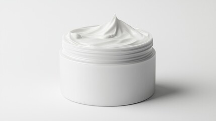 Creamy white moisturizer in a round jar on a plain background, showcasing its soft and inviting texture