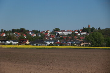 Fototapeta premium Rural area with houses and a church