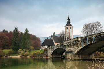 Lake Bohinj and church at sunset in Slovenia