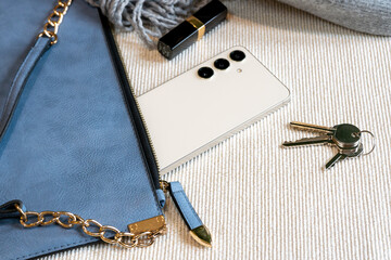 Blue ladies handbag with contents.