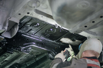 treatment of the car body bottom with anti-corrosion compound