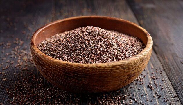 close up of bajra seeds in a rustic wooden bowl