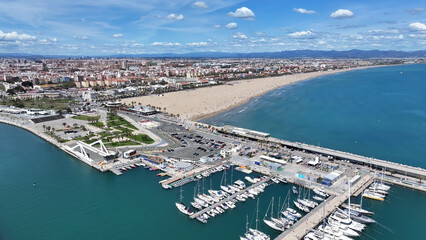 Fototapeta premium Las Arenas Beach At Valencia In Valencian Community Spain. Urban Beach. Bay Water Scenery. Downtown City. Las Arenas Beach At Valencia In Valencian Community Spain. Peaceful Landscape.