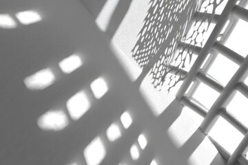 Abstract shadows play on a white surface