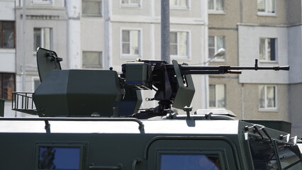 Place a fighter with a machine gun on the roof of an army armored vehicle for combat, all-round defense. Machine gunner's seat on the roof of an army vehicle