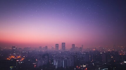 Fototapeta premium City skyline at twilight with stars aerial view