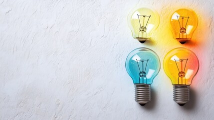 Colorful lightbulbs on white textured background innovation creativity concept