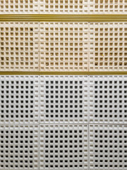 Interior tiles with square grid pattern and yellow lines.