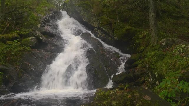 Stunning 4K drone footage of Belye Mosty Waterfall, Karelia&rsquo;s highest waterfall, cascading through a dense forest landscape in Russia&rsquo;s wilderness.