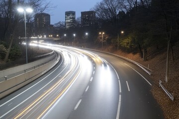 Obraz premium Night highway: moving light, car streak, urban glow, long exposure, illuminated road, vibrant motion, cityscape blur, speeding effect, luminous scene, traffic energy.