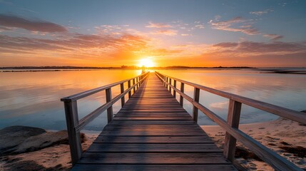 Obraz premium Capture the Sunset at the Jetty with Golden Hues and Coastal Atmosphere for Stunning Views