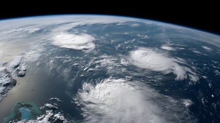 Astronaut perspective captures multiple swirling hurricane systems across Earth’s surface in breathtaking orbital view dramatic