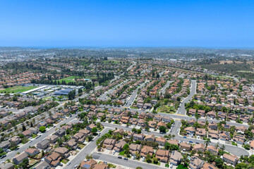Fototapeta premium Aerial view of San Marcos neighborhood with houses and street during sunny day, South California, USA.
