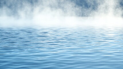 Fototapeta premium Serene water surface with mist tranquil blue ripples nature background