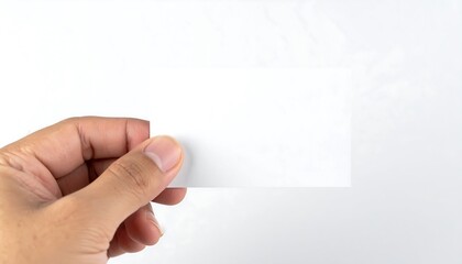 Fototapeta premium Human Hand Holding Blank White Card Against White Background