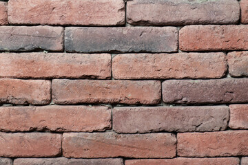 Close-up of a textured brick wall showcasing natural colors and patterns