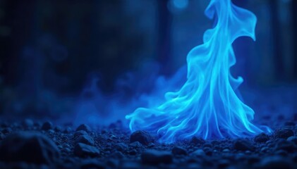 Mystical blue flames burning intensely in darkness , close up, indigo, flames