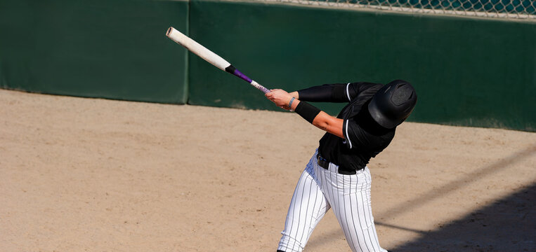 Softball Player Batting Swinging Hitting Baseball Female Fast Pitch Sport Athlete Banner Header - Powered by Adobe