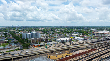 Obraz premium aerial shot of cars and trucks driving on the highway, office buildings and apartments at the New Orleans Union Passenger Terminal in New Orleans Louisiana USA