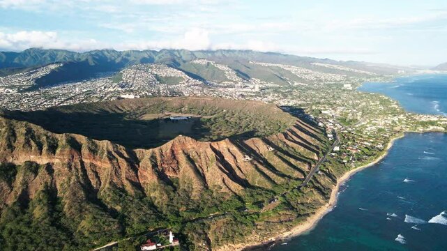 Aerial Panning Scenic Shot Of Volcanic Tuff Cone On Island, Drone Flying Over Wavy Blue Sea During Sunny Day - Honolulu, Hawaii