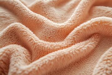 Close-up of soft, peach-colored fleece fabric