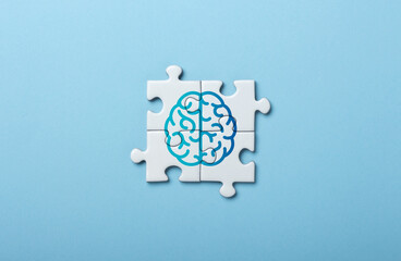 Brain Illustration on Puzzle Pieces Symbolizing Mind and Cognitive Concepts
