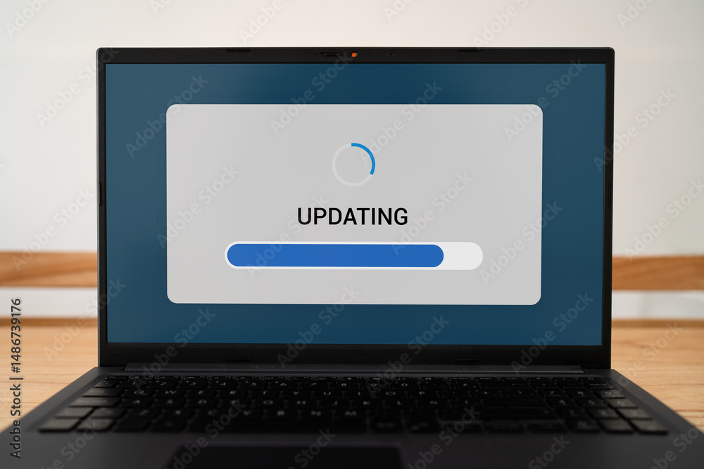 Wall mural concept of updating software process. progress bar on laptop screen.