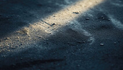 Close-up of dark textured surface with light streaks