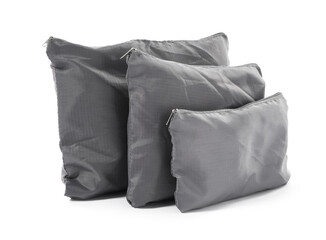 Grey packing bags isolated on white. Storage organizer