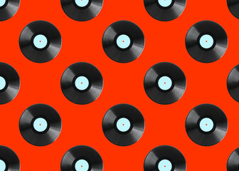 Pattern of vinyl records on red background
