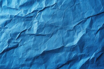 Fototapeta premium Close-up of crumpled, deep blue paper