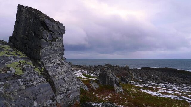 Aerial and ground-level 4K footage shows Hamningberg&rsquo;s rocky coastline, dramatic cliffs, and desolate Arctic wilderness in remote northern Norway.