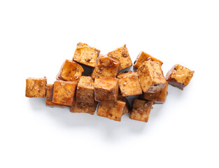 Pieces of fried tofu cheese with soy sauce on white background