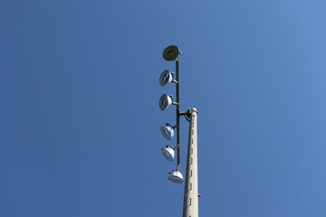 A view of a stadium lamp with many lights. Lighting of playground. Season of sport. 