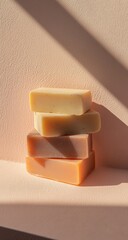 Stacked bars of pastel-colored soaps
