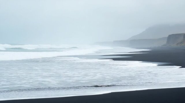 White Ocean Waves Crash Against Black Sand Beach in Iceland