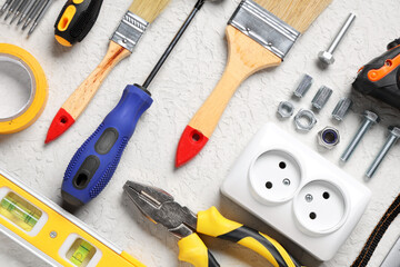 Arrangement of construction tools on white grunge background