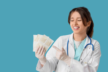 Female doctor pointing at mustard plasters on blue background