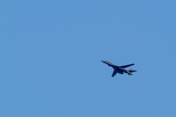 B1B Bomber flying in a blue sky
