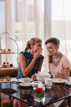 fashionable young women at a morning tea, gossiping
