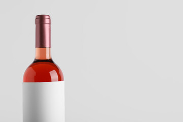 Bottle of wine with blank label on white background, closeup