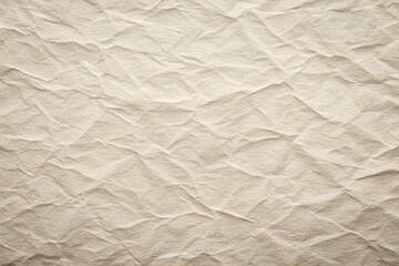 Obraz premium Crumpled beige paper texture with creases and soft organic surface detail