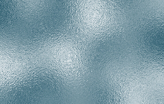 Shiny silver foil texture. Soft blue foil glass texture background. Abstract gradient bright light reflection and shiny rough texture surface. Glass effect background
